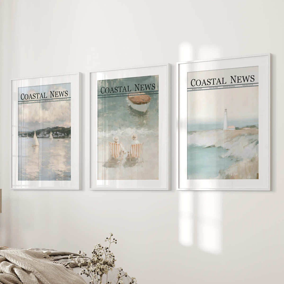 Set of three marina wall art prints in matted white frames, arranged near a bed in a bedroom.