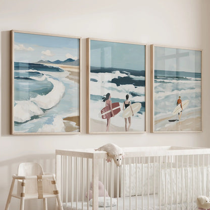 Beach shoreline triptych in light wood frames sits above the cot, bringing soft coastal tones to the infant’s room.