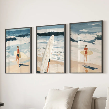 A trio of coastal beach wall prints, each in a black frame, steadies the family room behind the sofa with airy sea-washed color.