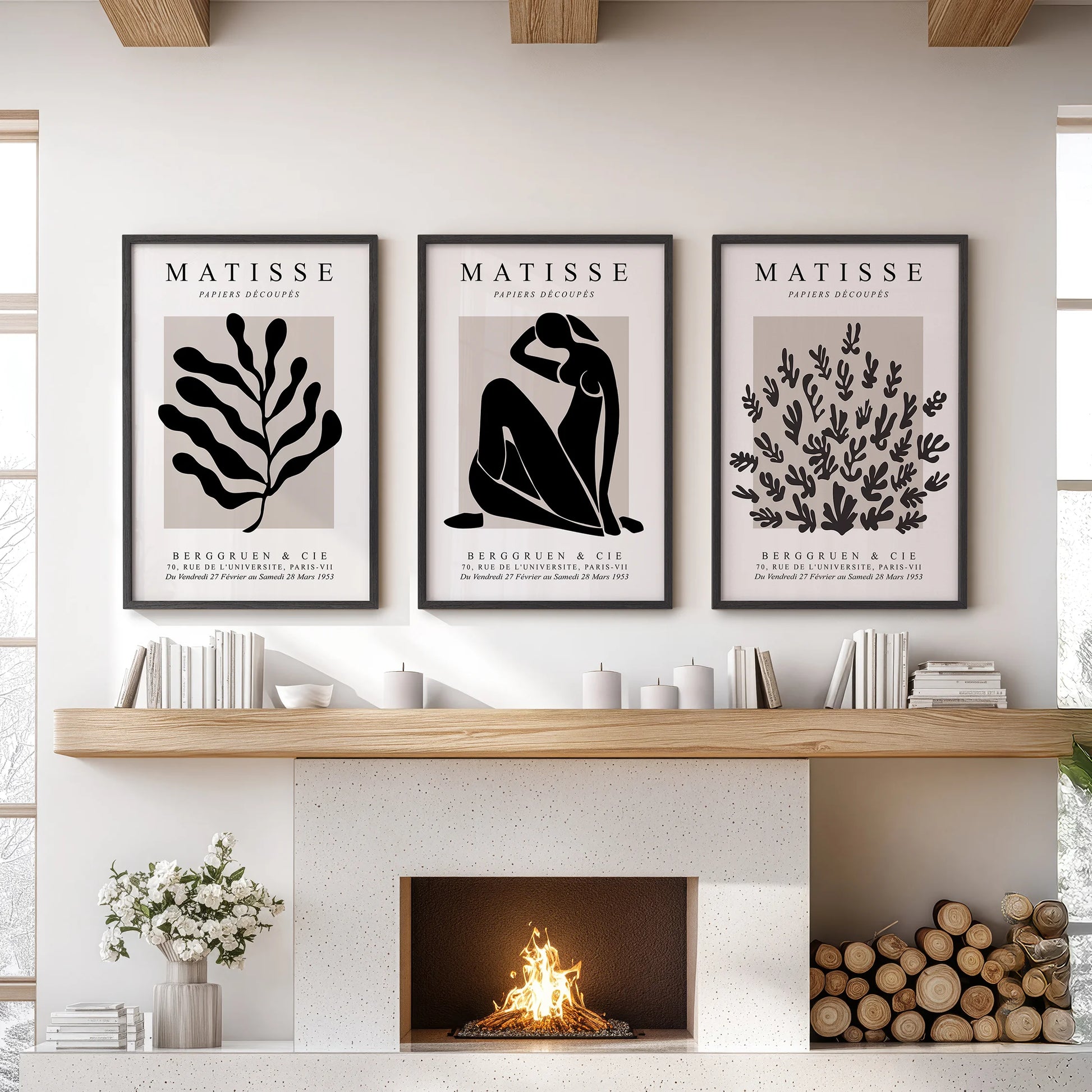 Three framed wall prints with Matisse-style cut-outs create a modern centerpiece above the sitting room fireplace mantel.