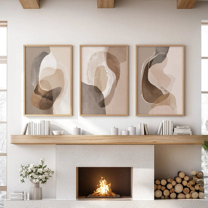 Rustic earthy color blocks three-piece picture set in warm oak frames sits above the mantelpiece, lending understated boho texture to the sitting room.