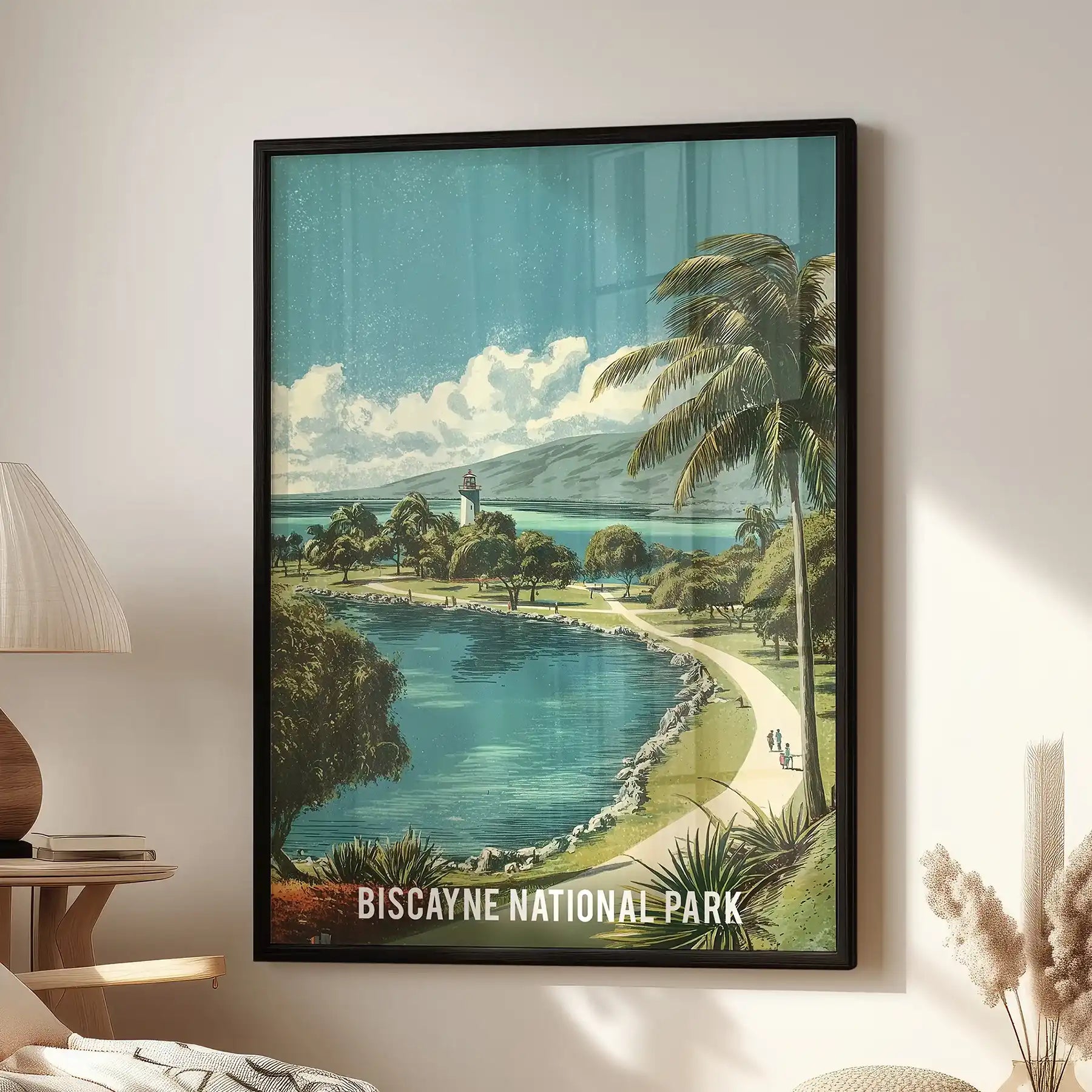 Biscayne National Park home wall art print in a black frame sits beside a living room reading chair, showing a retro bay scene with lush green shoreline.