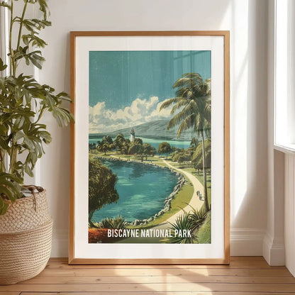 A black-framed coastal landscape print, matted and resting on the bedroom floor, portrays Biscayne’s clear bay water and soft retro shoreline.