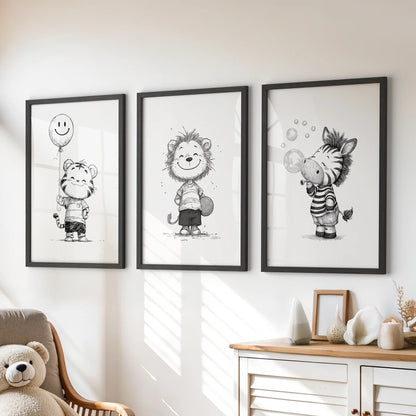 Three black-framed prints of safari animals decorate the kids room above a chest of drawers, giving the space a playful, monochrome touch.