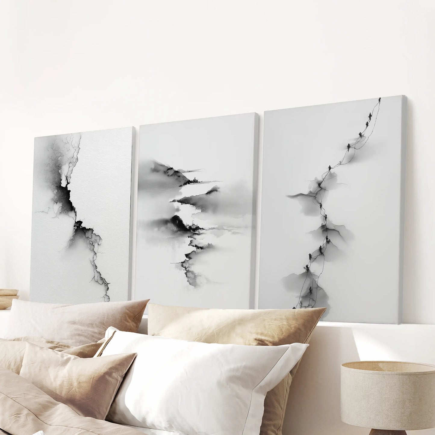 A three-piece gallery-wrapped landscape canvas set floats over the headboard, bringing quiet modern softness to the bedroom.