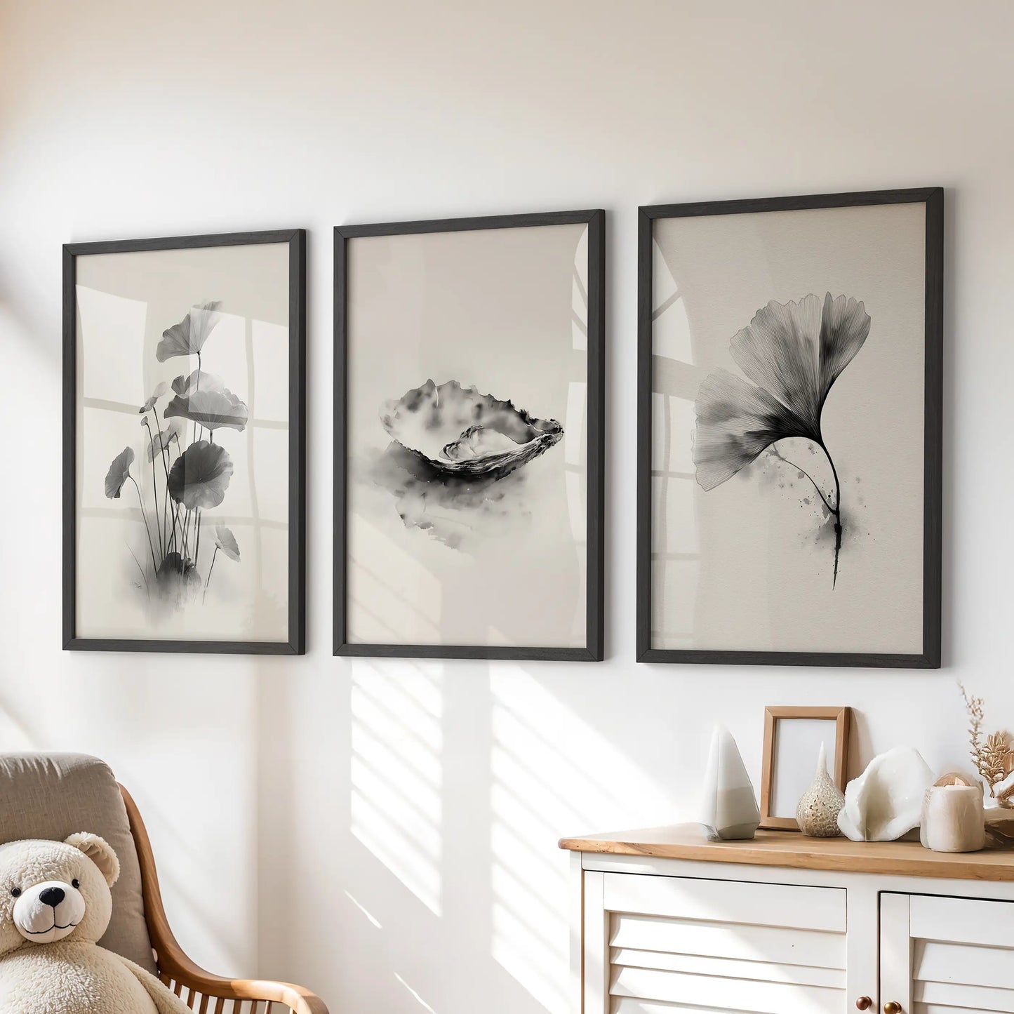Oriental brushwork botanicals, a trio of framed wall art prints in black, sit over the chest of drawers to add calm balance to the kids' playroom.