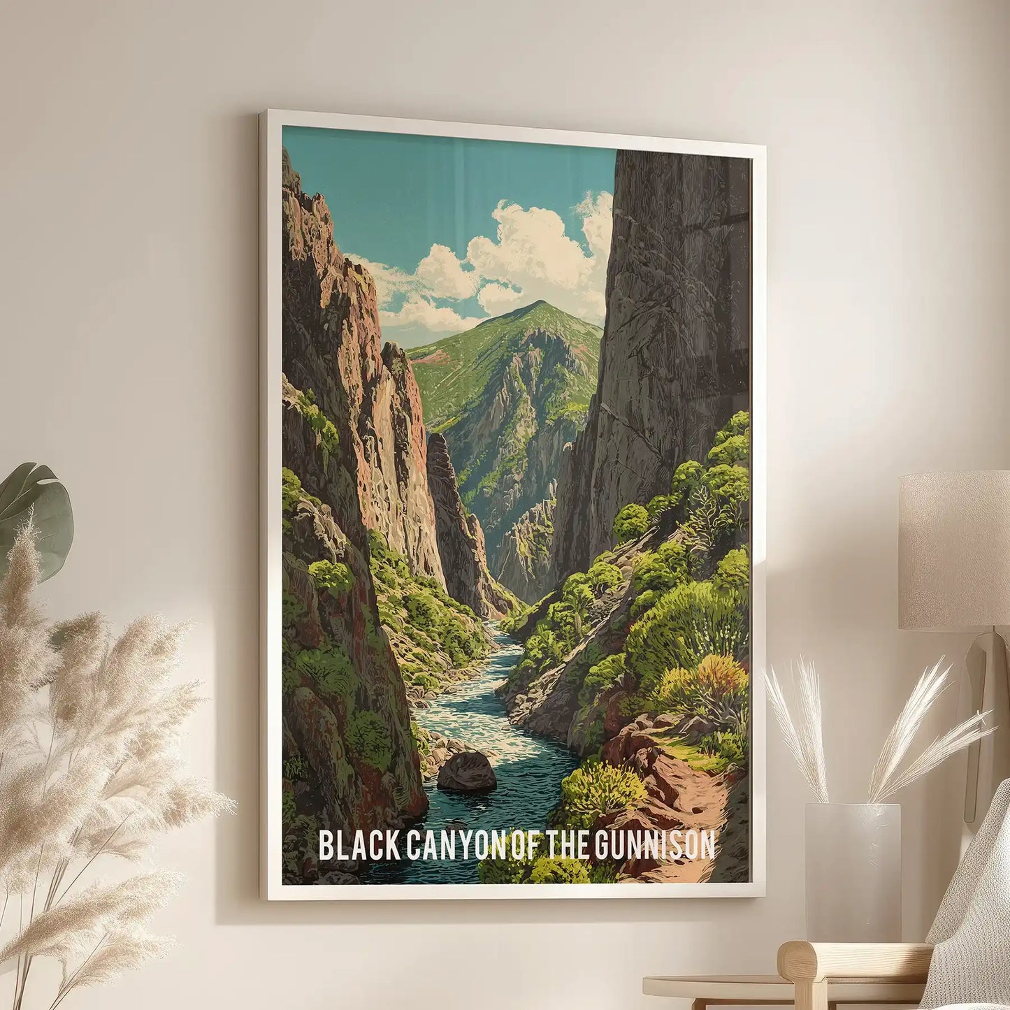 An individual wall art piece showing Colorado national park scenery sits in a white frame, brightening the family room beside an accent chair.