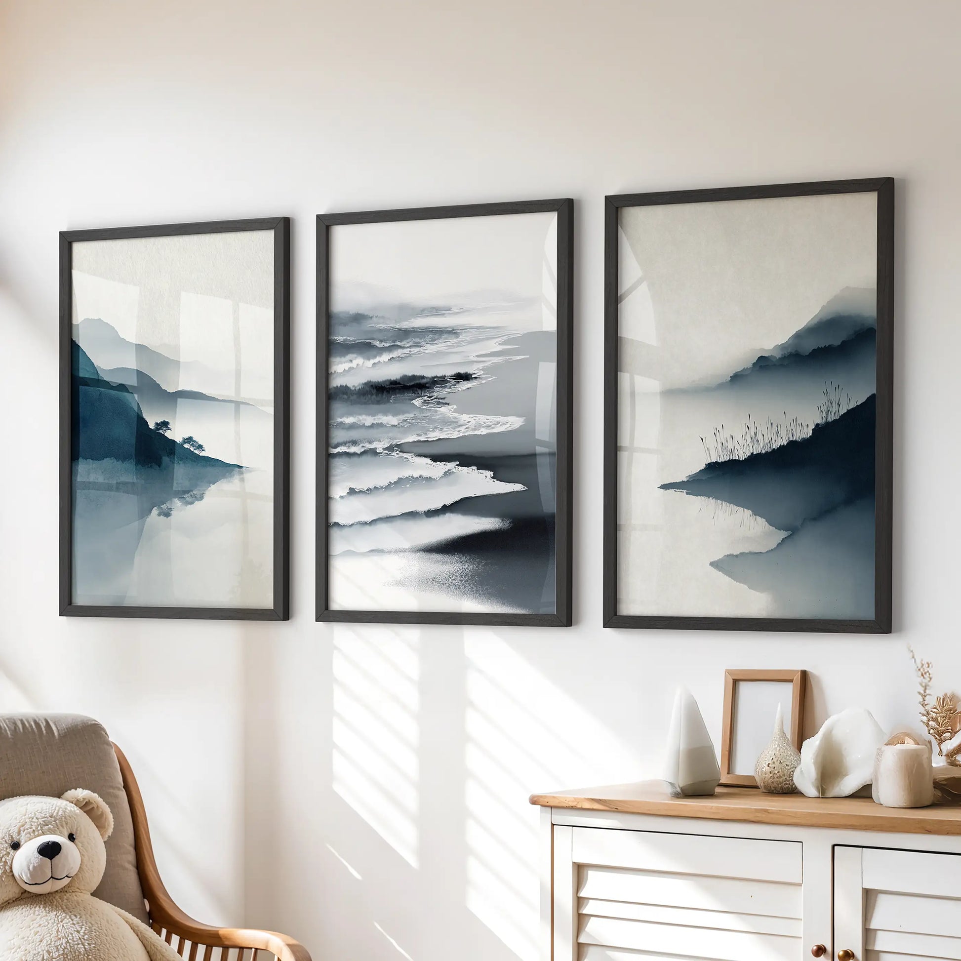 Coastal abstract waves wall art, a set of 3 large prints, hangs over the chest of drawers in the kids' playroom with crisp black frames.