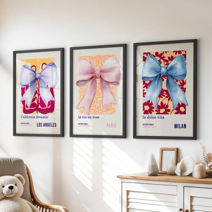 Pastel ribbon bows, a 3-piece kids’ wall art set in slim black frames, sit sweetly above the dresser for a tidy, preppy pop of color.