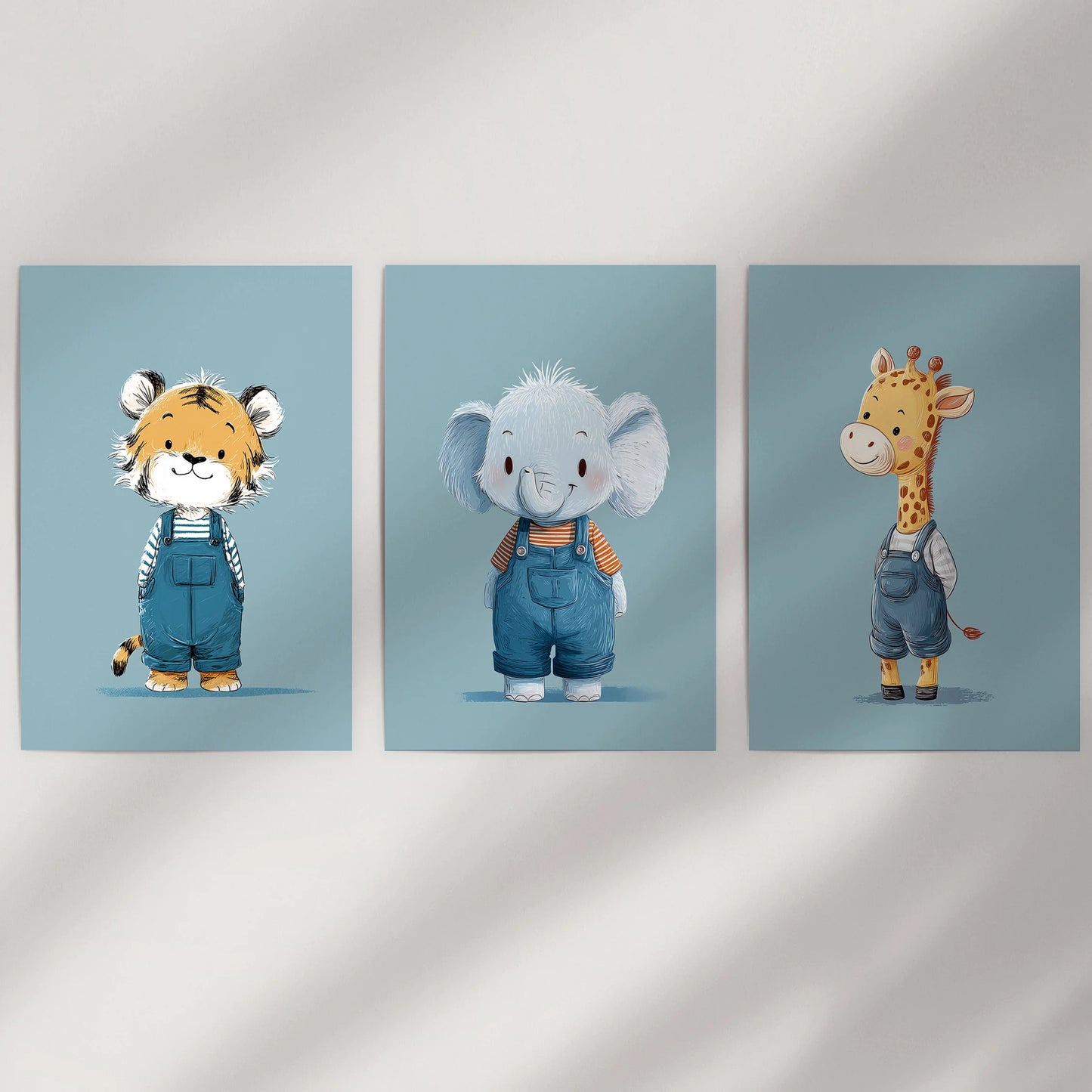 Elephant, giraffe, and tiger in blue, a 3-piece wall art set displayed as loose prints on a minimal dining room wall for a clean, modern feel.
