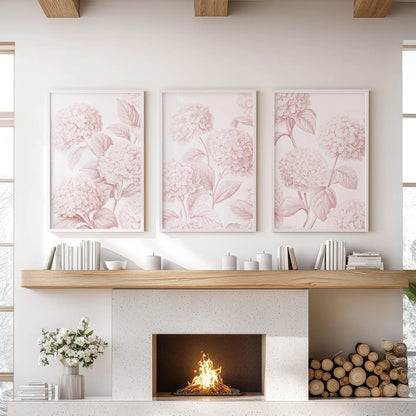 Blush pink hydrangeas fill three white-framed prints above a fireplace.