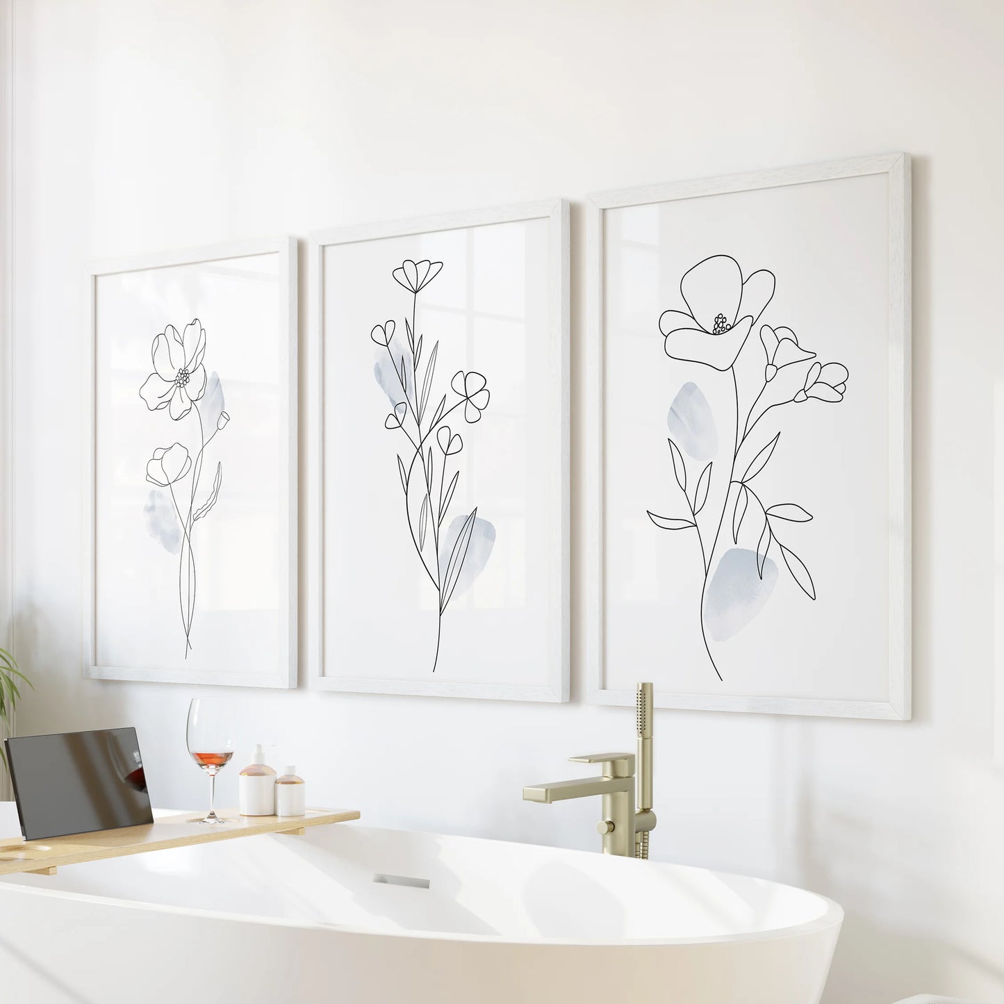 Pastel blue watercolor flowers, 3 wall art set, brings a soothing note to the bathroom over the tub in crisp white frames.