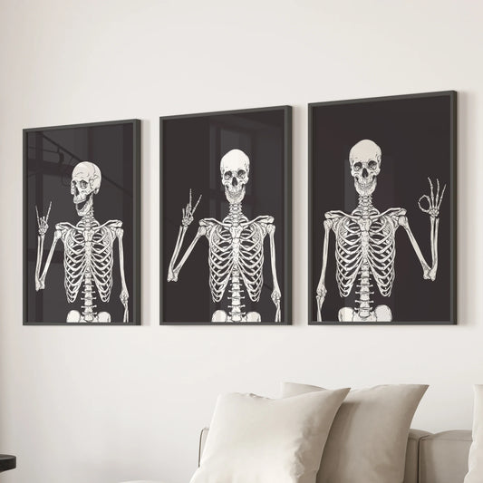 Black-framed skeleton prints in a 3-piece wall art collection lend the family room above the sectional sofa a light, spooky flair.