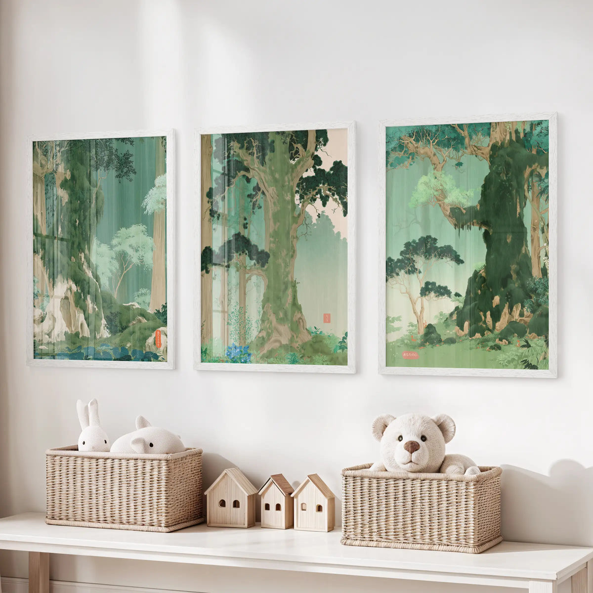 Three-piece green botanical scenery wall art in white frames hangs over a storage bench in the kids' playroom.
