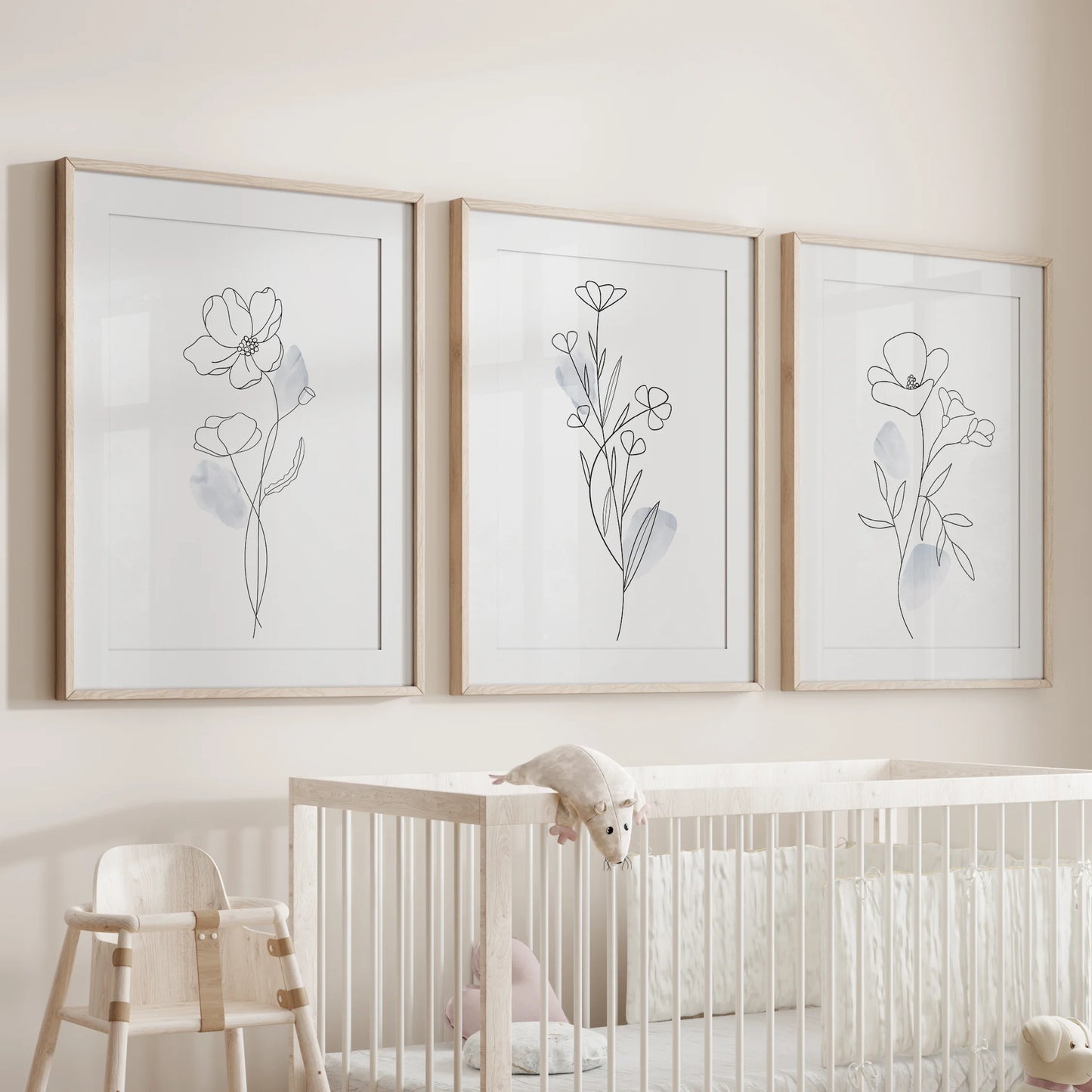 Abstract floral line sketches, 3 pc wall art set in wooden frames with mats, perches above the bassinet to soften the nursery room.