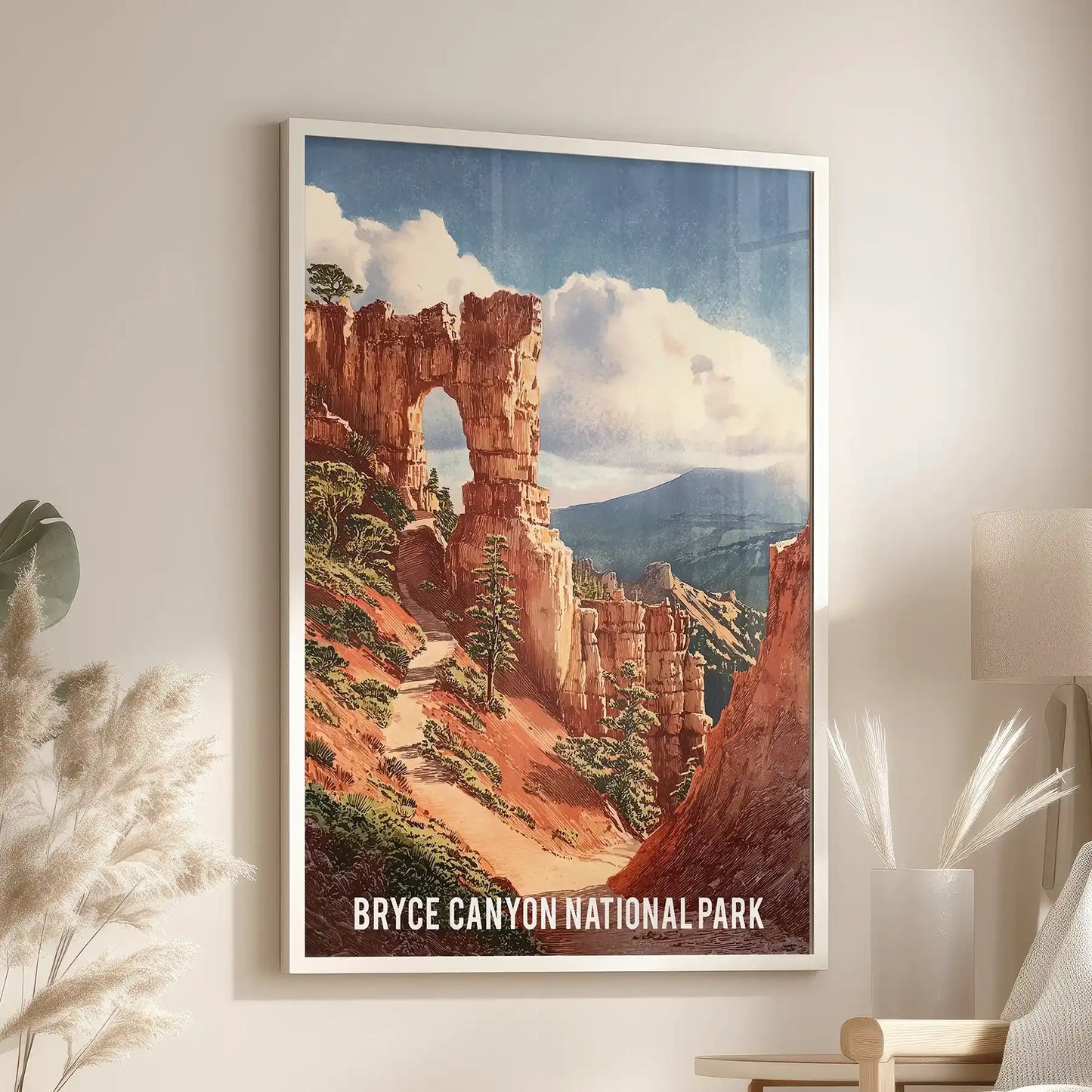 Adventure mountain trail one poster in a white frame settles near the reading chair, lending the living room a bright, trailhead calm.