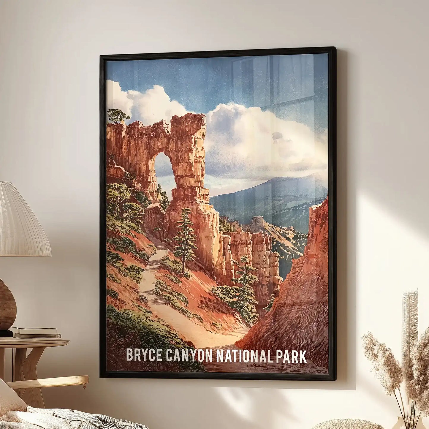 A black-framed wall art print of Bryce Canyon’s red-orange hoodoos hangs over a reading chair, grounding the cozy living room with sunlit color.