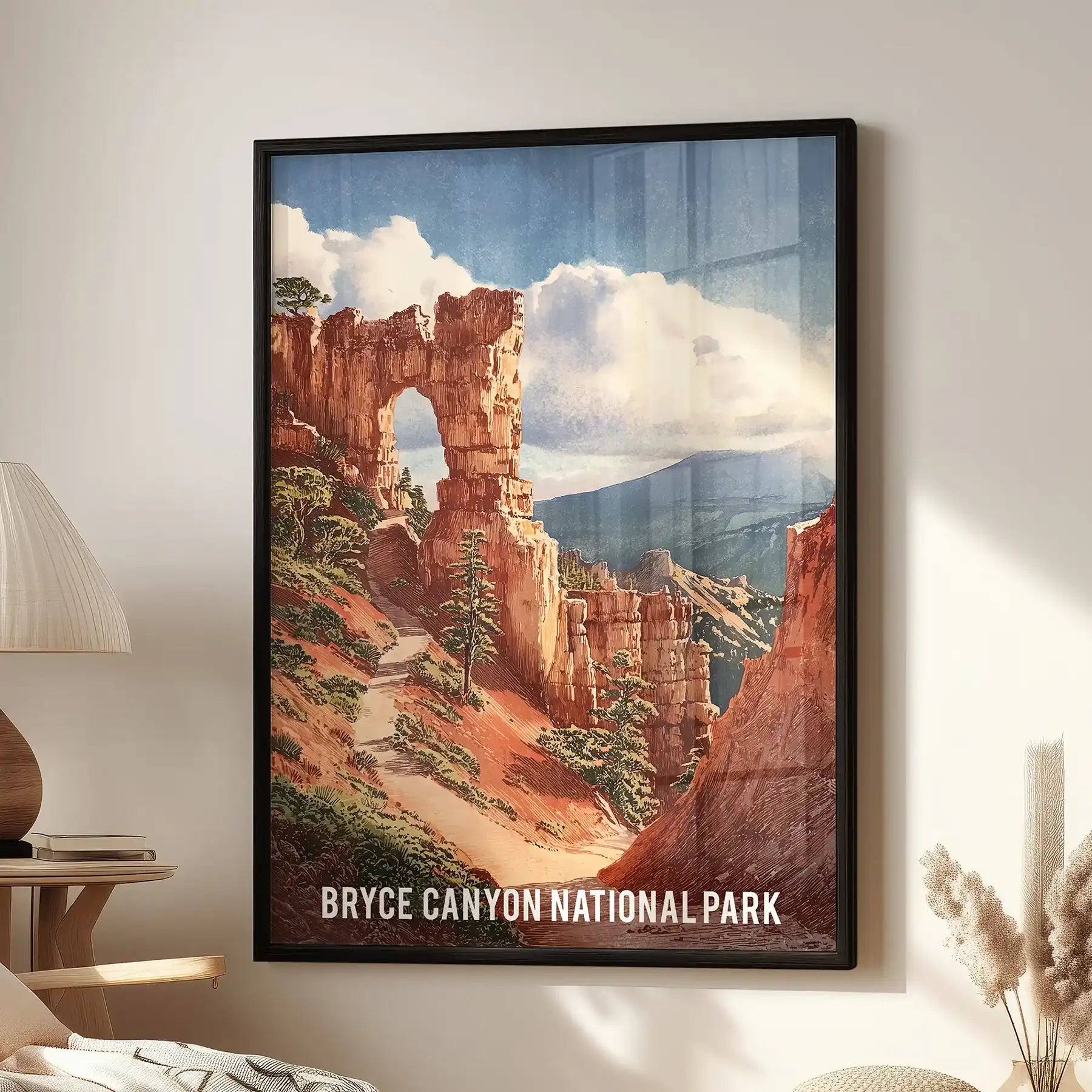 A black-framed wall art print of Bryce Canyon’s red-orange hoodoos hangs over a reading chair, grounding the cozy living room with sunlit color.