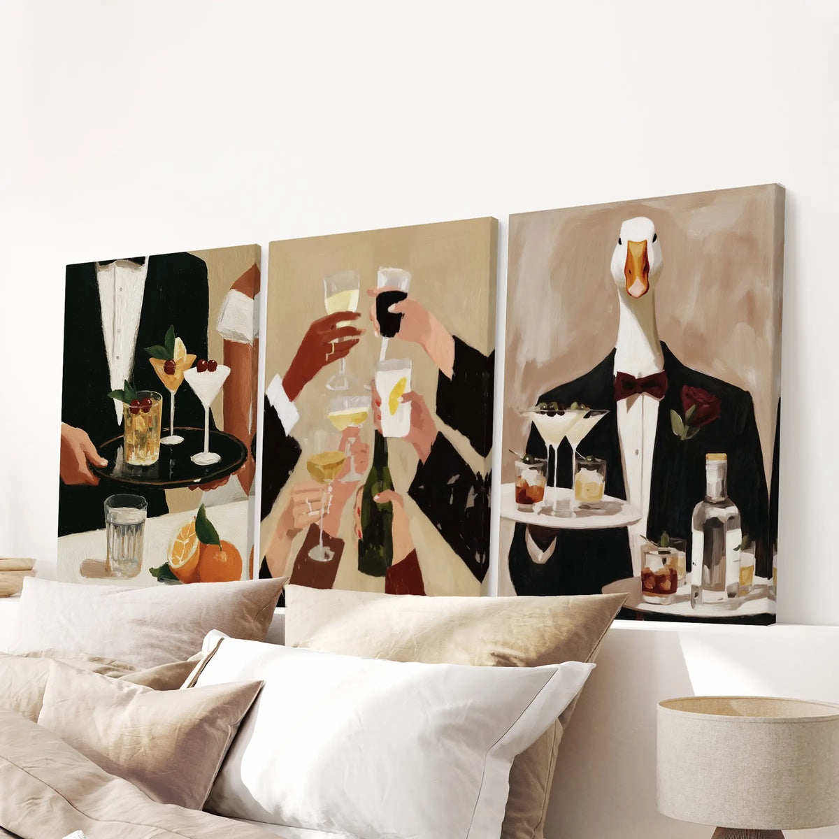 Cafe cocktail wall art in a three-piece set of wrapped canvases, displayed over a bedroom bed.