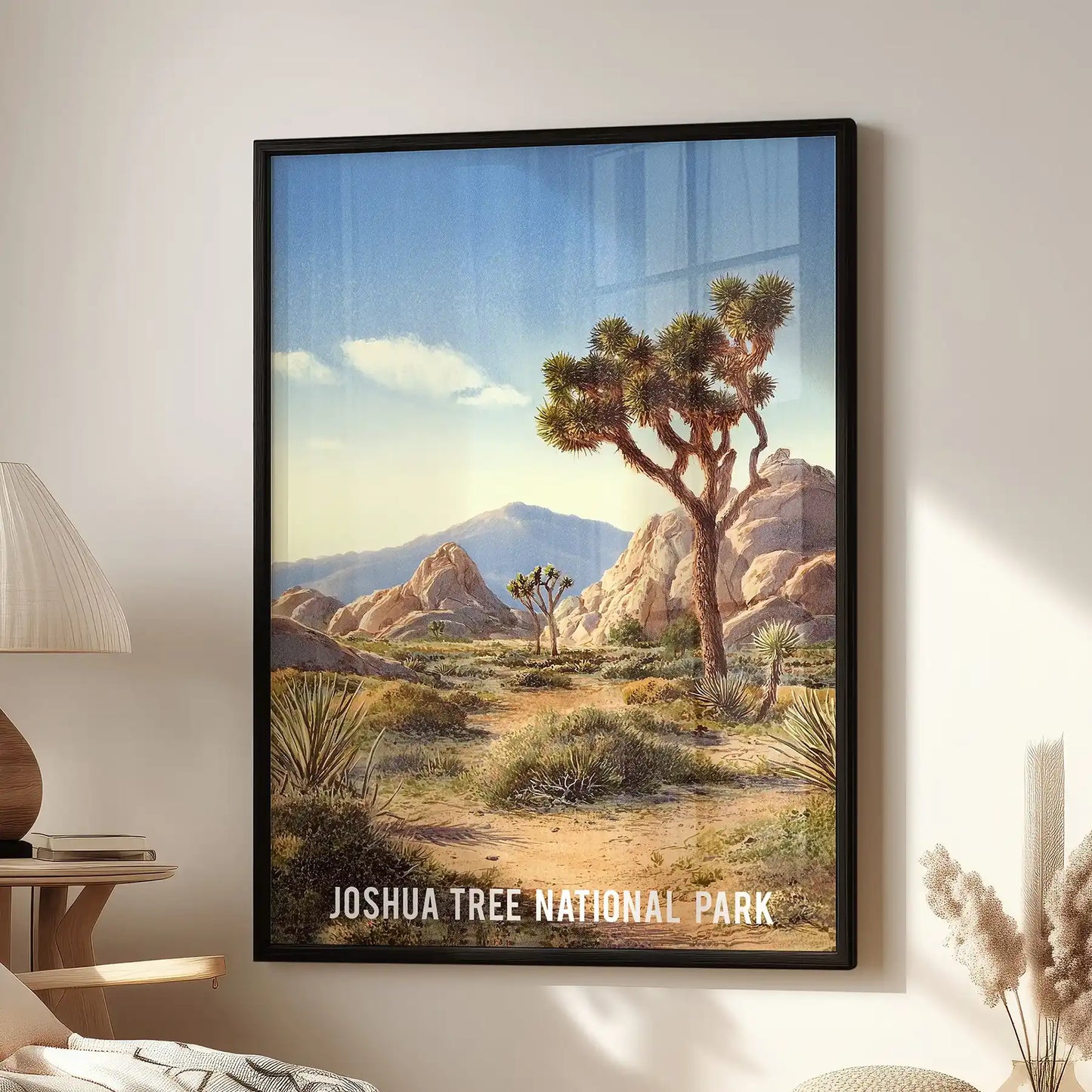 Joshua Tree National Park landscape gallery-wall poster hangs in the lounge, a black-framed print mounted over the reading chair for a calm, modern feel.