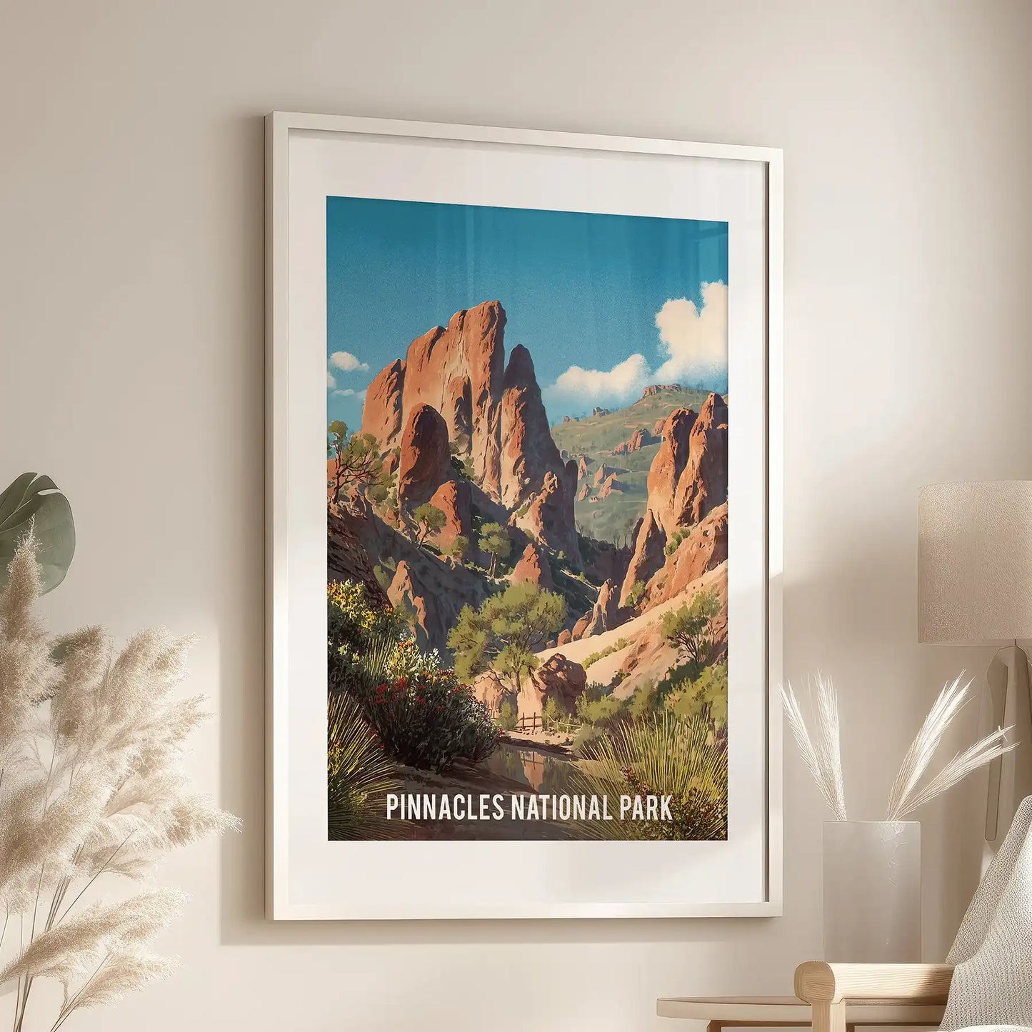 One-panel travel poster print of a California park sits in a white frame with matting, balanced above the living room lounge for a fresh finish.