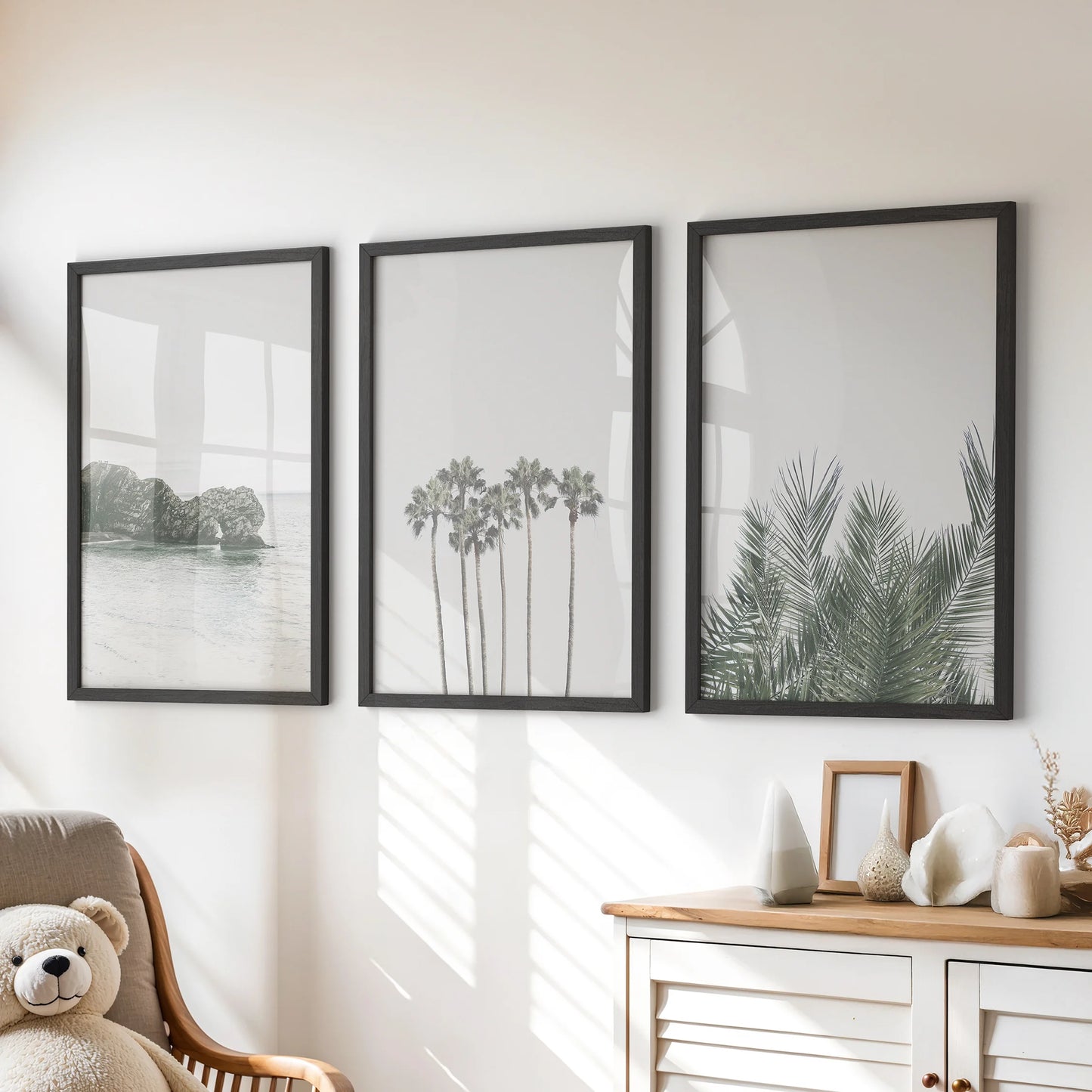 This 3-print bundle of tropical shoreline photos in simple black frames creates a breezy focus over the playroom chest of drawers.