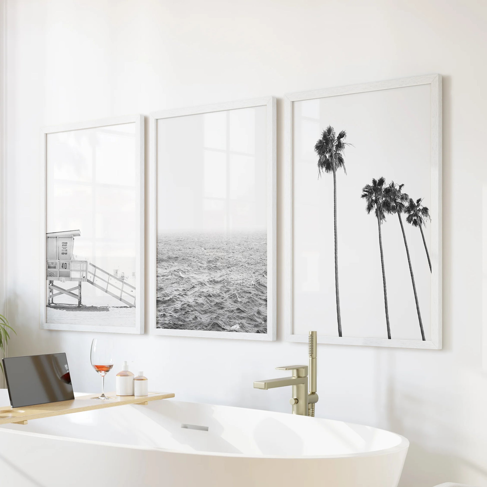 California palm trees, a wall art three-piece set in crisp white frames, bring breezy movement to the bathroom, poised over the tub wall.