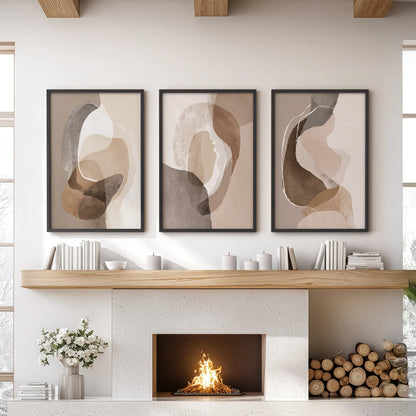 Boho abstract shapes set of 3 wall prints, black framed, hang centered above the hearth to ground a living room with warm beige and brown earth tones.