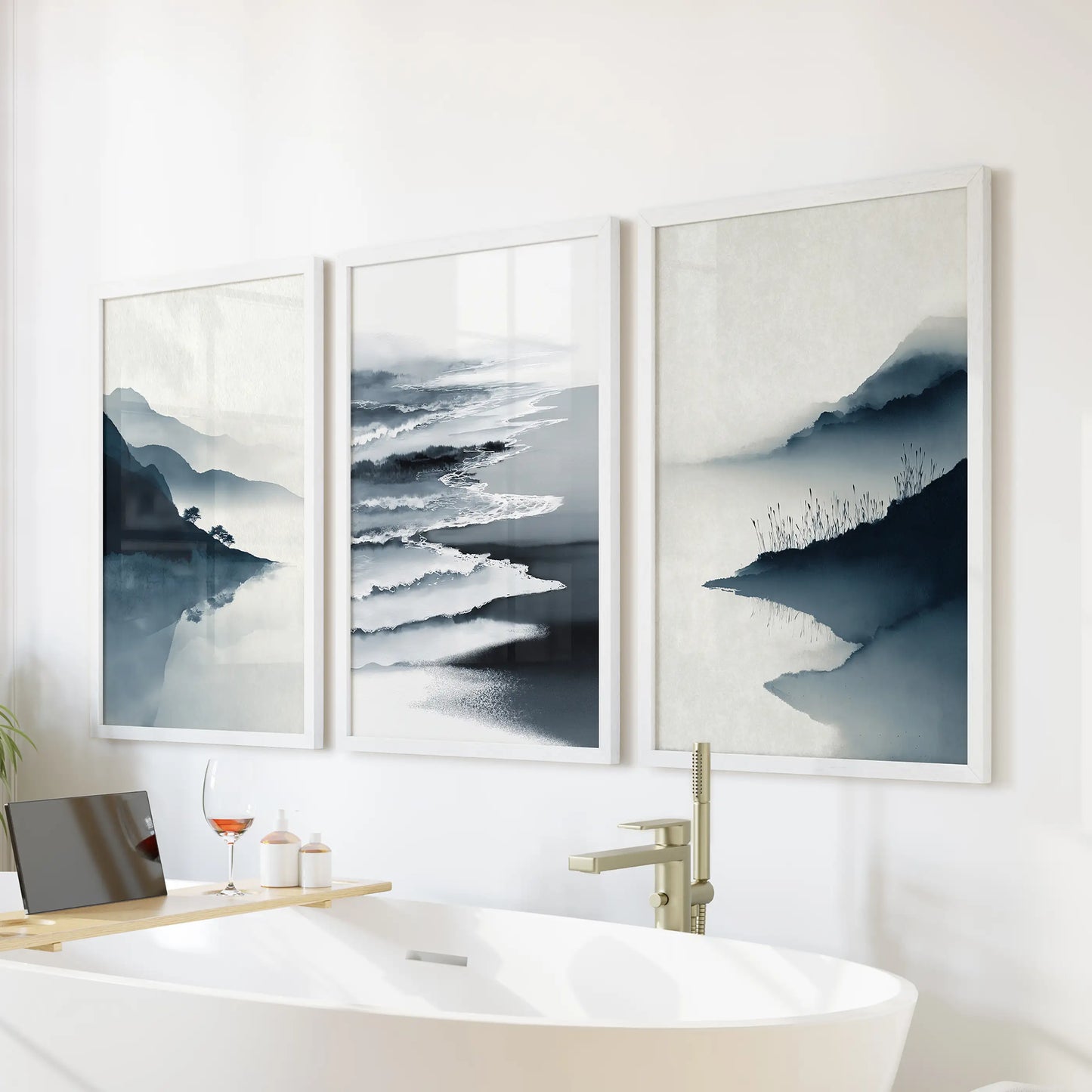 This 3-print shoreline bundle of blue beach scenes sits above the bathtub, white frames giving the bathroom a clean spa-like calm.