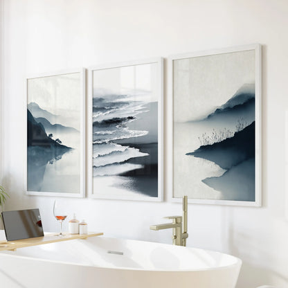 This 3-print shoreline bundle of blue beach scenes sits above the bathtub, white frames giving the bathroom a clean spa-like calm.