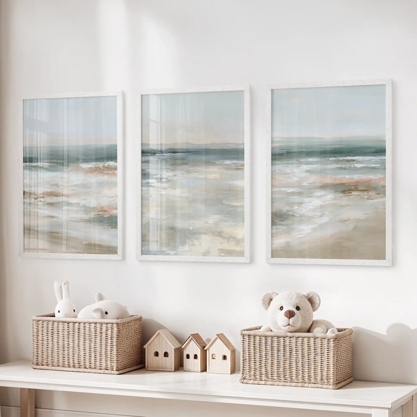 A gallery trio of horizon prints in crisp white frames hangs over the storage bench, softening the kids room with calm coastal air.