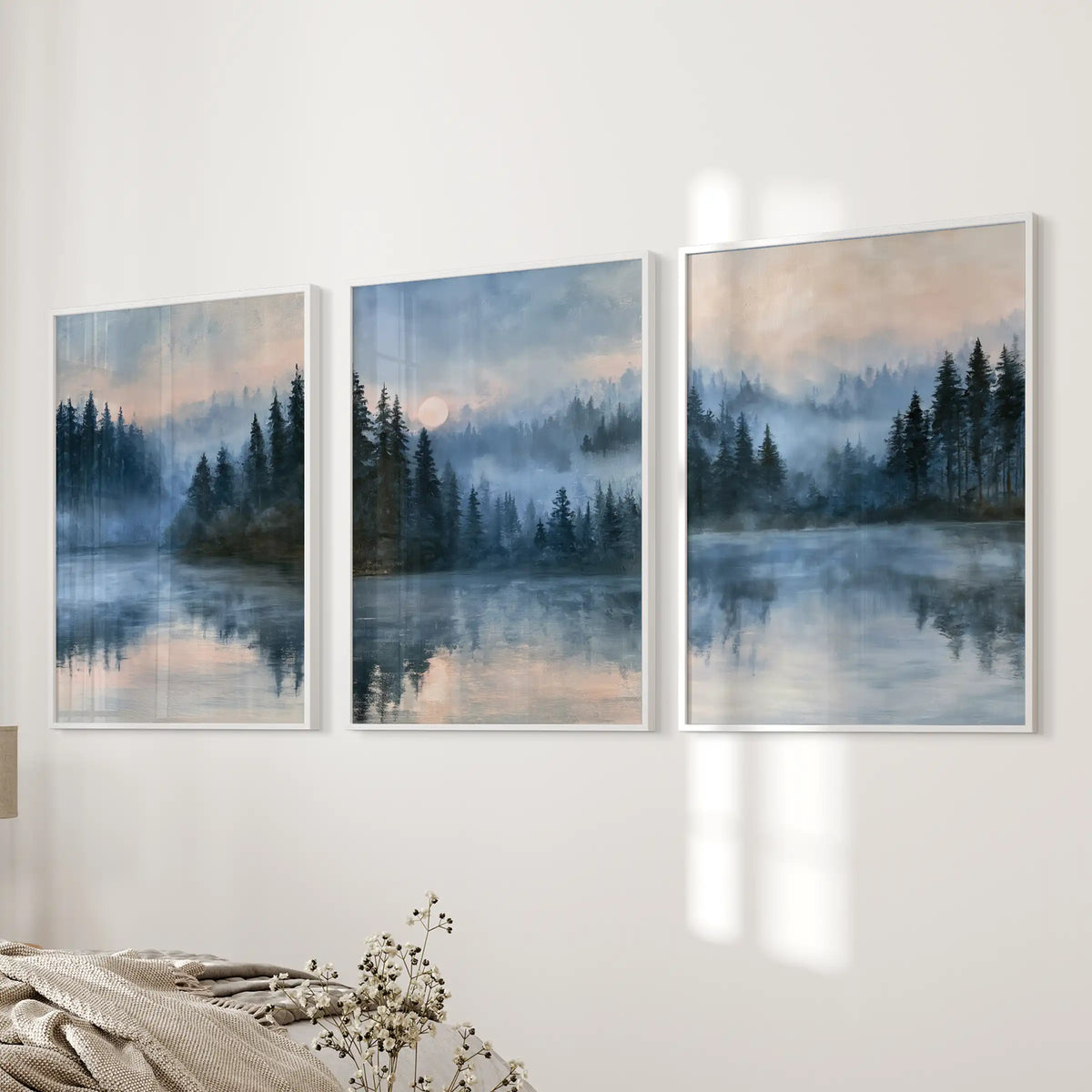 Moonlit blue landscape three-piece gallery wall in clean white frames settles beside the bed, lending soft nocturne hues and gentle depth to the bedroom.