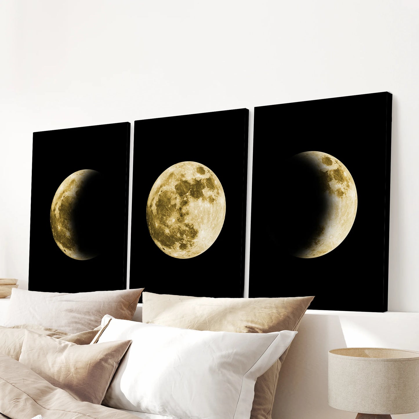 A gold moon phase triptych printed on gallery-wrapped canvas hangs above the headboard, bringing a tranquil celestial center to the bedroom.