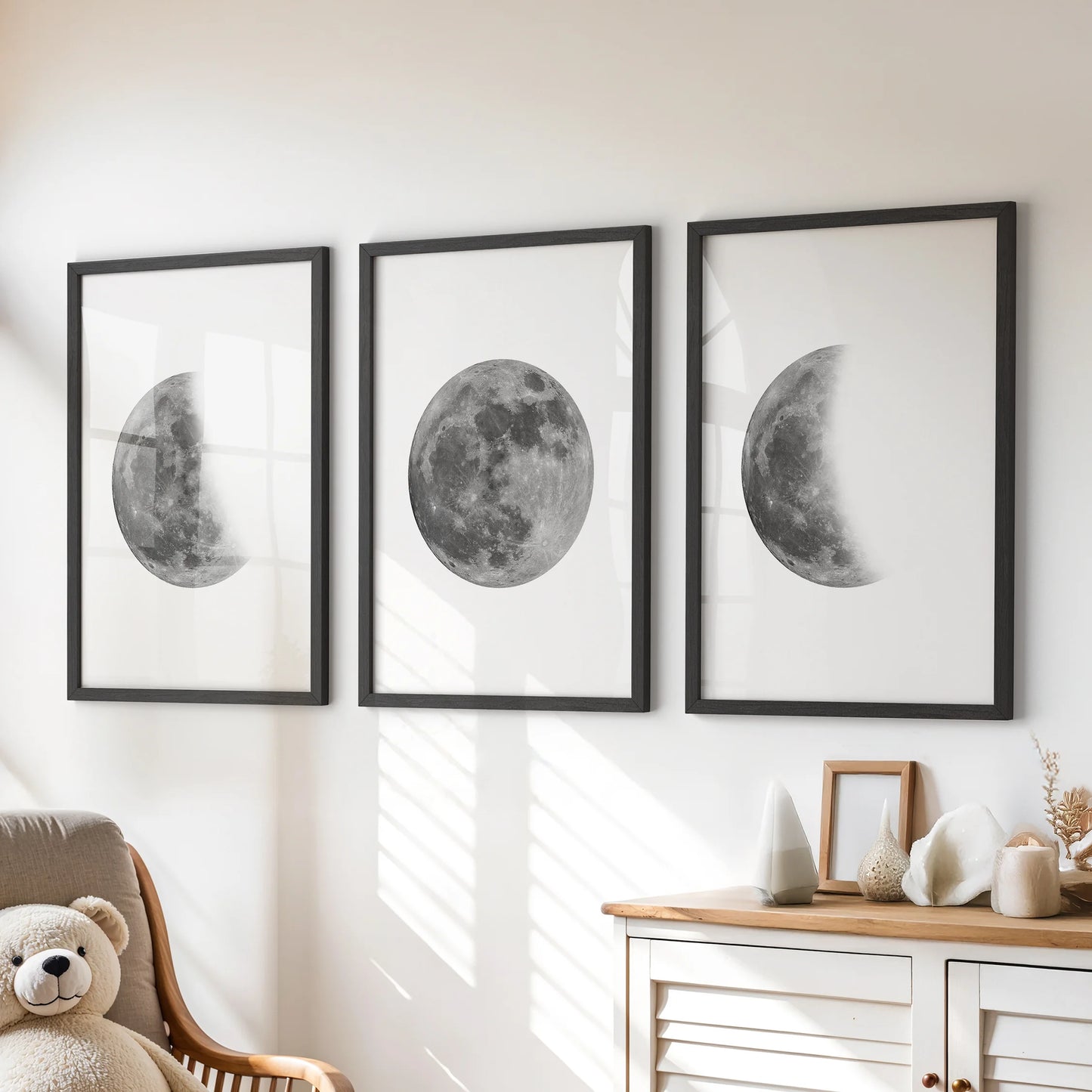 Moon phases sequence 3-print wall art set in black framed prints, styled over the dresser to give the playroom a calm, star-bright focal point.