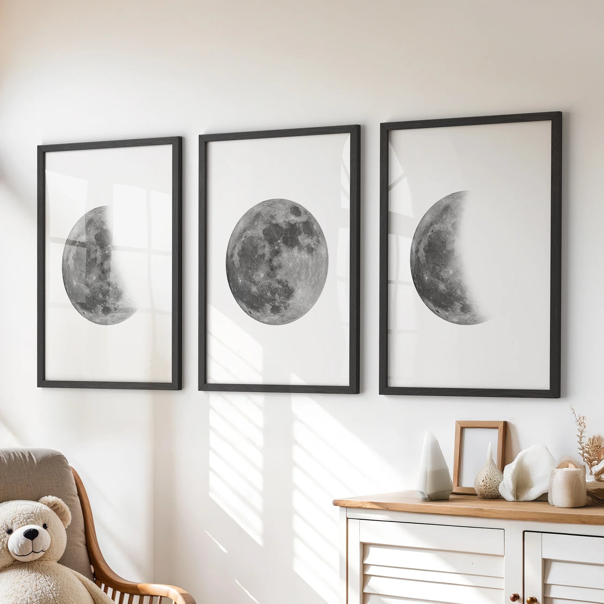 Moon phases sequence 3-print wall art set in black framed prints, styled over the dresser to give the playroom a calm, star-bright focal point.