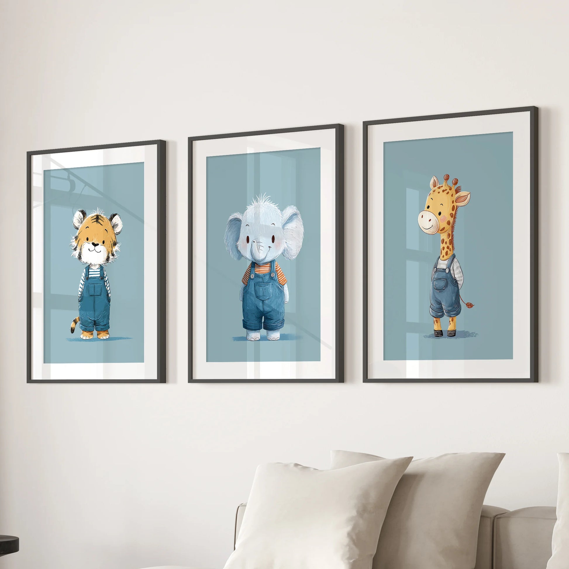 Three jungle animal art posters with black mats and frames bring soft blue color to the family room wall above the couch.