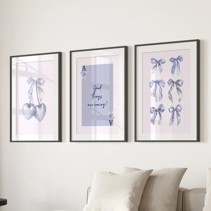A trio of blue cherry illustration wall hangings pop in black matted frames above the family room couch, infusing a calm burst of color.