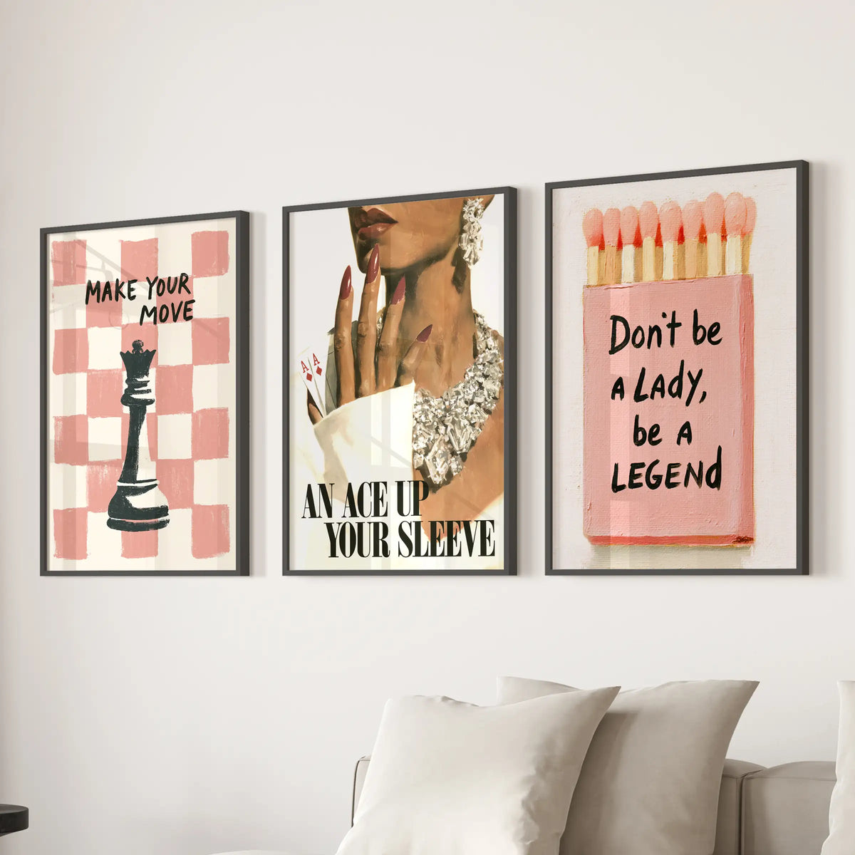 Pink matchbox three-print wall art set in black frames, hung above a sectional sofa in the sitting room.