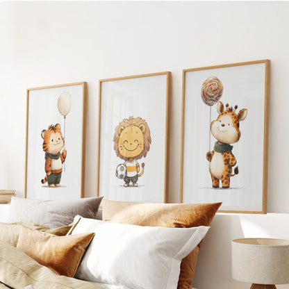 Three jungle-animal prints in warm oak frames form a small gallery above the bed’s headboard, giving the bedroom wall a natural, cozy tone.