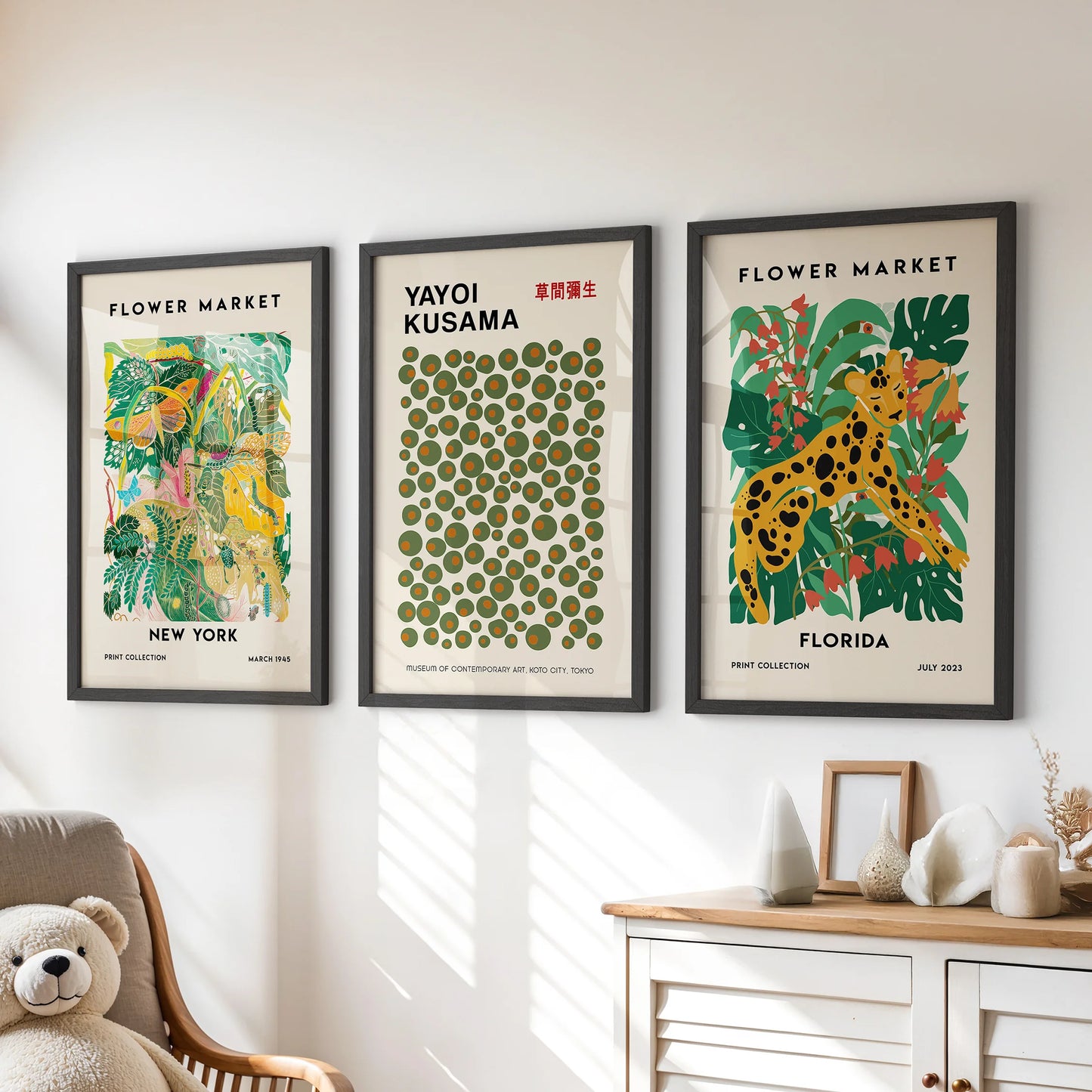 Set of three New York city prints, done in bold black frames, give the playroom dresser wall a grounded, graphic balance.