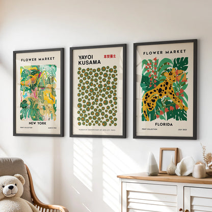 Set of three New York city prints, done in bold black frames, give the playroom dresser wall a grounded, graphic balance.