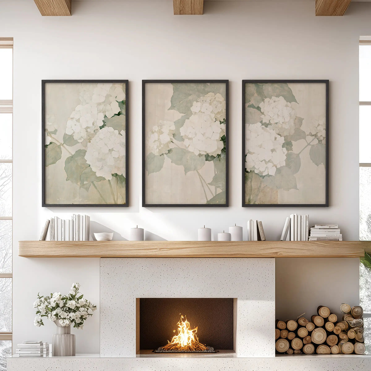 Three-piece hydrangea wall art set in black frames, hanging above a fireplace mantel in the family room.