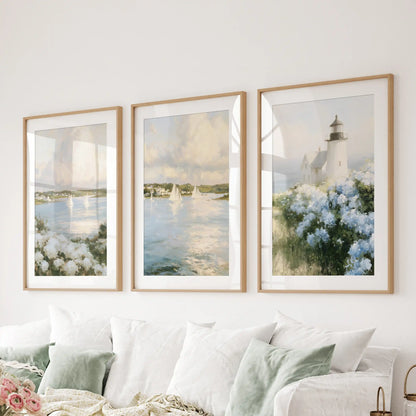 Wall art prints of Nantucket sailboats come as a set of three, matted in warm wood frames, creating an easygoing focal line above the sitting room sectional.