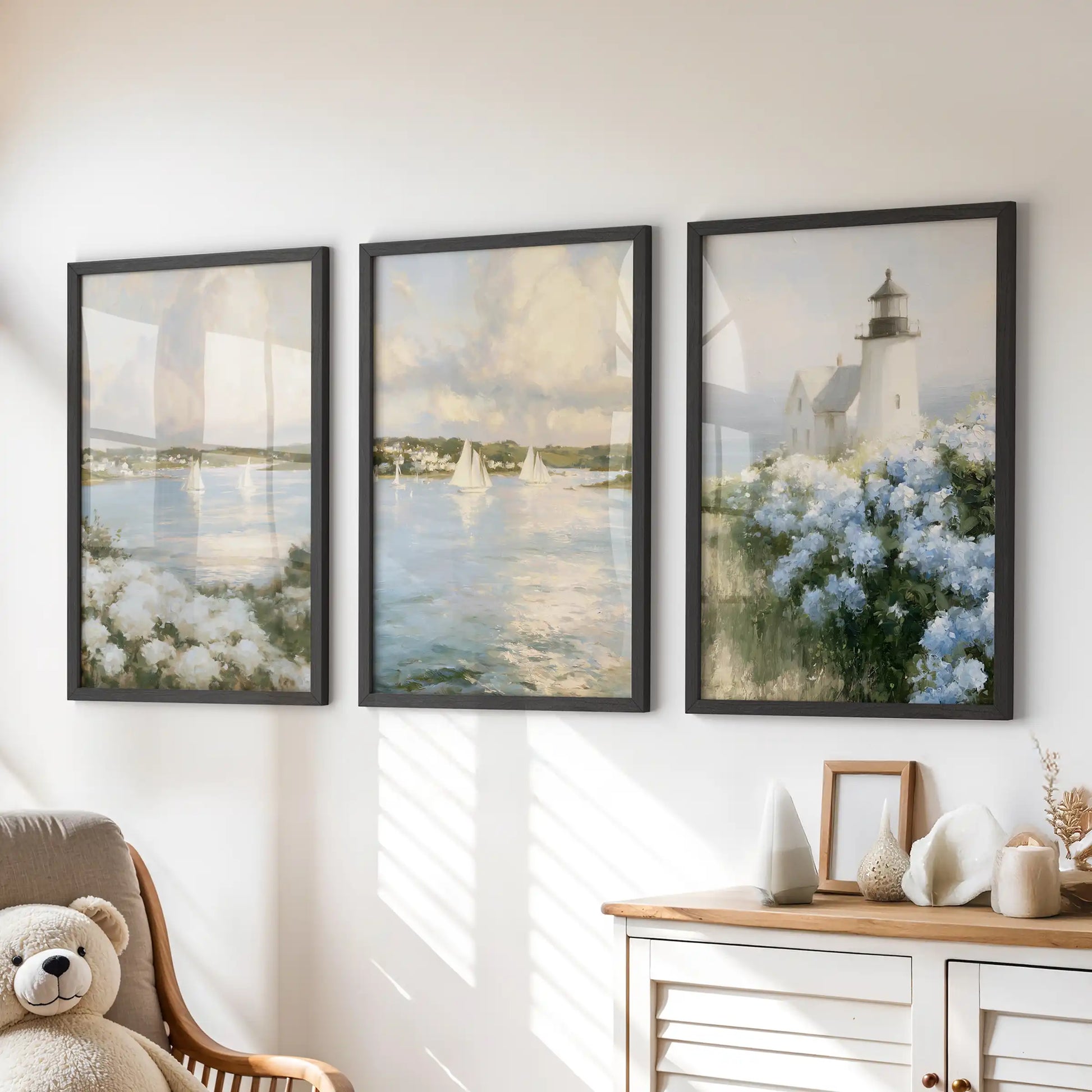 A trio of wall art prints with blue and white hydrangeas sits in black frames, adding a soft coastal touch above the dresser in a kids room.