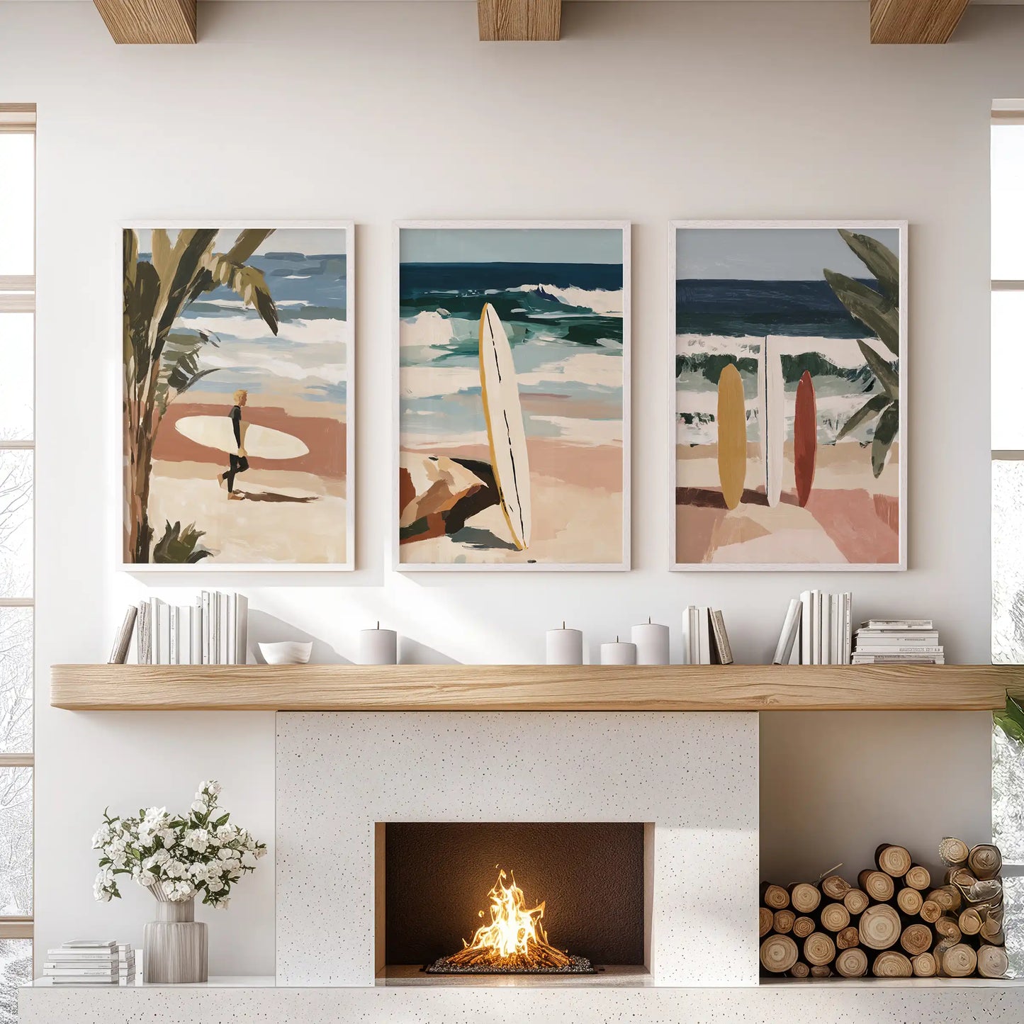 Three tropical art prints in white frames span above the sitting-room mantel, blending palms, surf, and wide horizon light.
