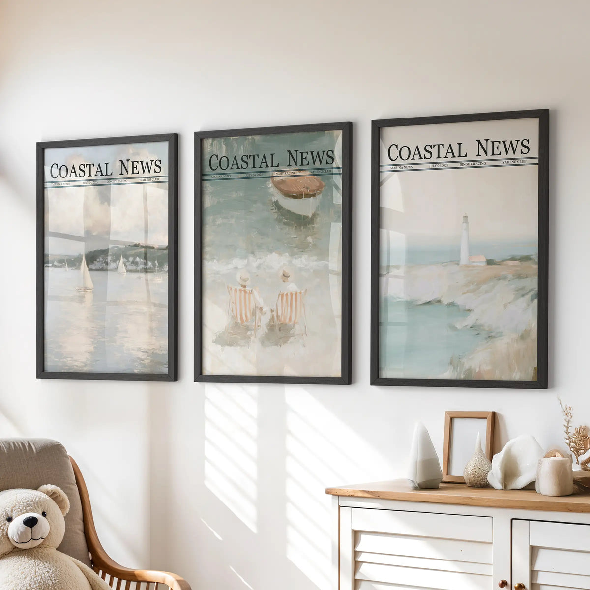 Set of three wall posters in black frames, depicting sailboat, beach, and lighthouse scenes above a kids' room dresser.