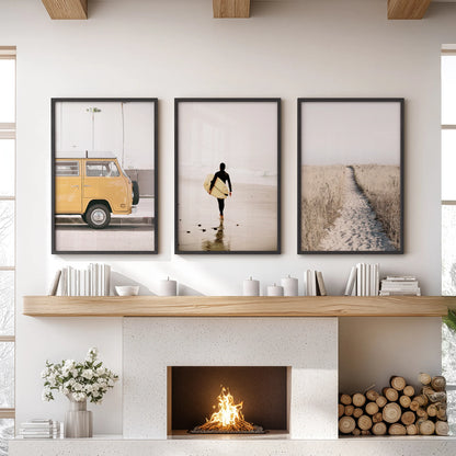 Coastal path and dunes wall art trio set, hung above the mantle in black framed prints, brings breezy shoreline calm to a relaxed lounge.