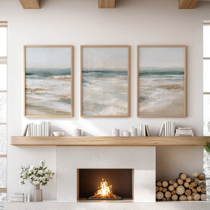 Three wooden-framed seascape prints line the wall above the mantelpiece, giving the sitting room a fresh, measured sweep of coastlight.