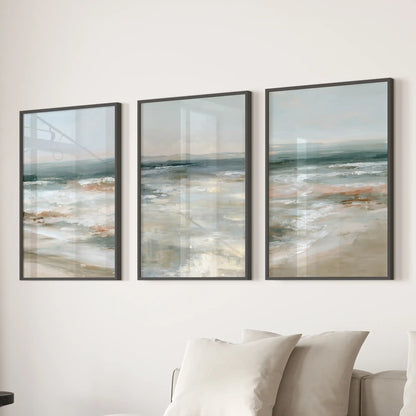 Distant sea horizon poster set of three brings airy wall art in slim black frames above the sofa, freshening the living room with soft blues.