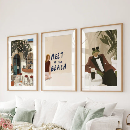 Riviera coastal town views in a three-print wall decor set, mounted in light oak mats and frames, sit neatly behind the sitting room couch.